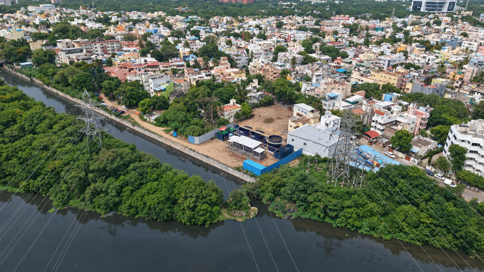 Aerial view of the Kotturpuram water reclamation plant beside the canal and surrounding Chennai neighbourhood