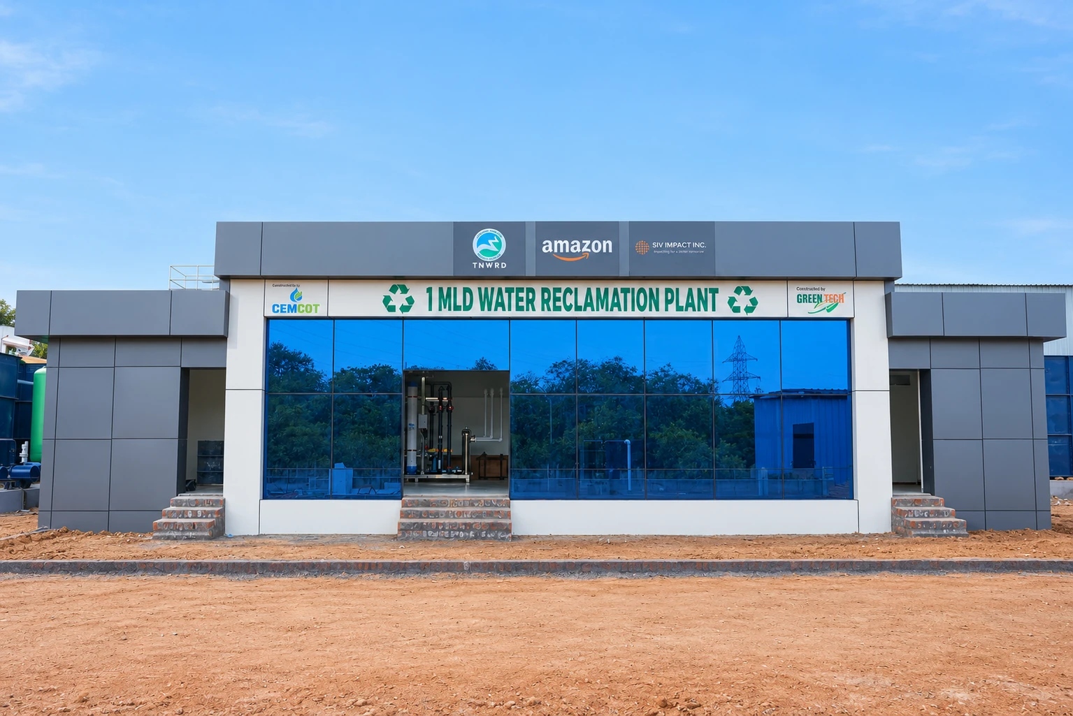 Front of the Chennai water reclamation plant, with TNWRD, Amazon, SIV Impact, CEMCOT and GreenTech signage